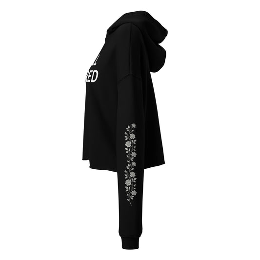 Still Sacred Crop hoodie flowers on left and right arm, left view