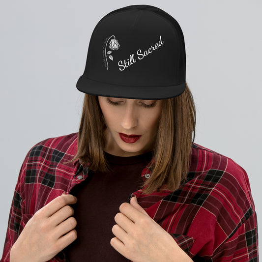 Black Still Sacred 5-panel trucker cap – front view streetwear accessory