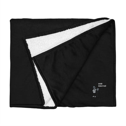 Premium Still Sacred Sherpa Blanket, Nix and Luna folded top view.