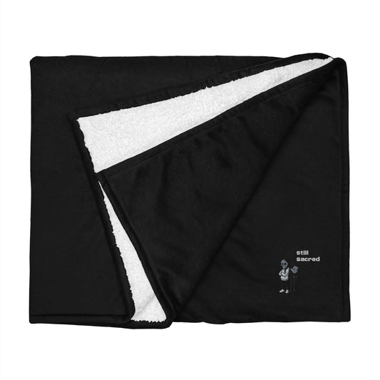 Premium Still Sacred Sherpa Blanket, Nix and Luna folded top view.